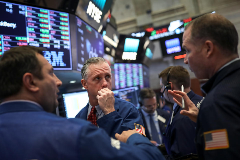 NEW YORK, NY - APRIL 2: Traders and financial professionals work on the floor on the New York Stock Exchange (NYSE) ahead of the closing bell, April 2, 2018 in New York City. The Dow Jones industrial average was down nearly 450 points at the close on Monday afternoon. After several Twitter attacks from President Trump, Amazon stocks continued to fall. (Photo by Drew Angerer/Getty Images)