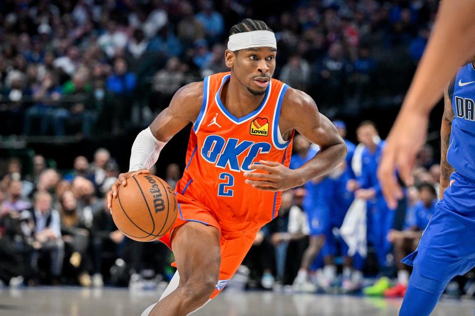 Oklahoma City guard Shai Gilgeous-Alexander brings the ball up court during the second quarter Saturday at American Airlines Center in Dallas.