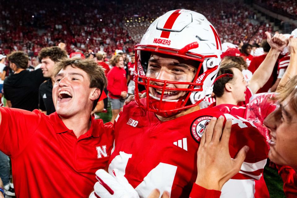 Nebraska tight end Luke Lindenmeyer celebrates with fans after defeating the Colorado Buffaloes at Memorial Stadium on Sept. 7.