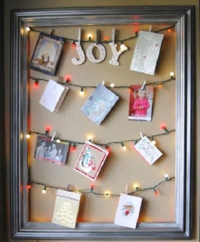 Trade in light strands on a framed holiday card display