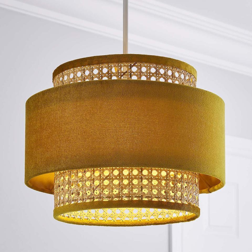 <p>This is a clever twist on the traditional velvet drum shade. A cane tier peeks from underneath this warm ochre lampshade for a thoroughly contemporary mix of textures. A great choice to soften an extra luxe space.</p><p><strong>Shop now: <a href="https://www.dunelm.com/product/nova-velvet-and-cane-shade-30cm-1000181511" rel="nofollow noopener" target="_blank" data-ylk="slk:Nova Velvet and Cane Shade at Dunelm;elm:context_link;itc:0;sec:content-canvas" class="link ">Nova Velvet and Cane Shade at Dunelm</a></strong></p>