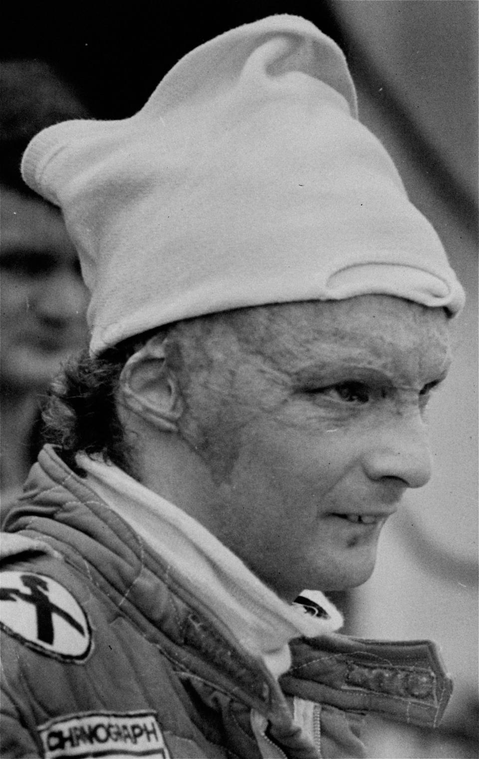 FILE - In this Friday, January 23, 1977 file photo Austria's Niki Lauda, driving for Ferrari during a pit stop at the Grand Prix of Brazil. Three-time Formula One world champion Niki Lauda, who won two of his titles after a horrific crash that left him with serious burns and went on to become a prominent figure in the aviation industry, has died. He was 70. (AP Photo, File)