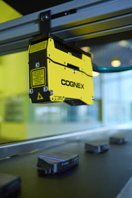 The Cognex In-Sight L38 mounted over an assembly line, inspecting products in 3D.