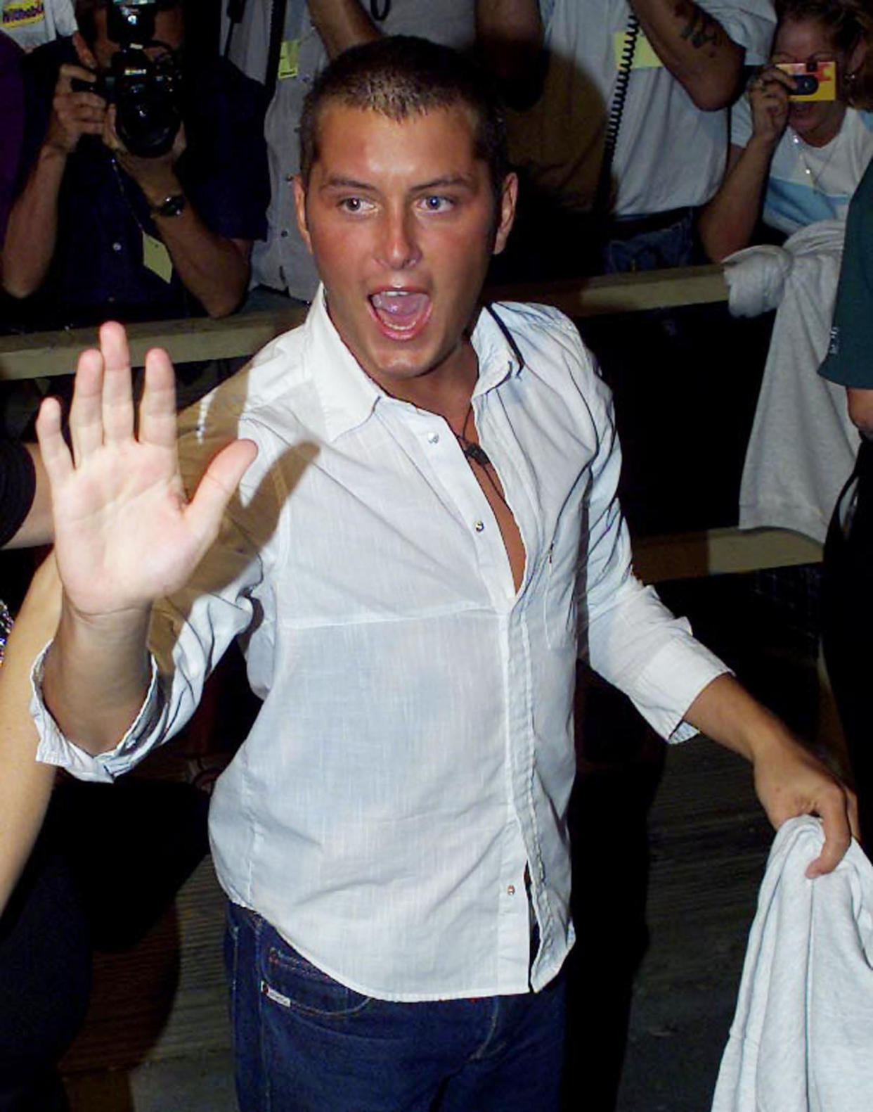 Big Brother contestant Brian Dowling waves as he leaves the house July 27, 2001. Over 7 million viewers voted in the game show final with Dowling winning the top prize of 70,000 pounds Sterling ($99,792).