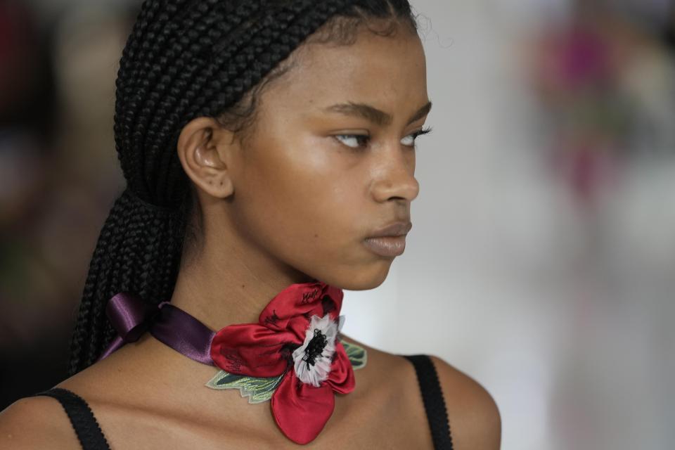 A model wears a creation as part of the Tomo Koizumi women's Fall-Winter 2023-24 collection presented in Milan, Italy, Sunday, Feb. 26, 2023. (AP Photo/Luca Bruno)