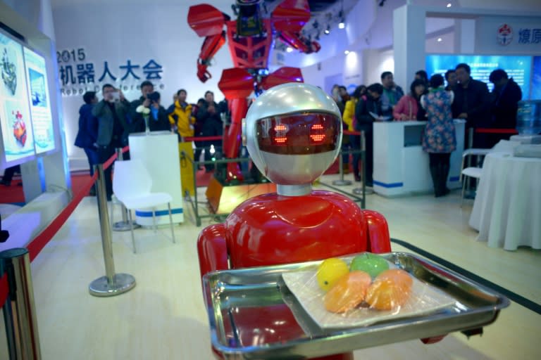 Vehicles with automated gun turrets sat alongside drink-serving karaoke machines at the World Robot Conference, as manufacturers sought new buyers for their "jiqiren" -- "machine people" in Chinese