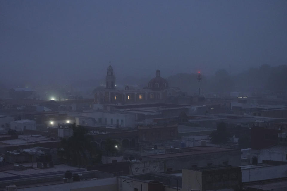 Volcanic ash from the Popocatépetl volcano covers Atlixco, Mexico, Monday, May 22, 2023. The volcano's activity has increased over the past week. Evacuations have not been ordered, but authorities are preparing for that scenario and telling people to stay out of 7.5-mile (12-kilometer) radius around the peak. (AP Photo/Marco Ugarte)