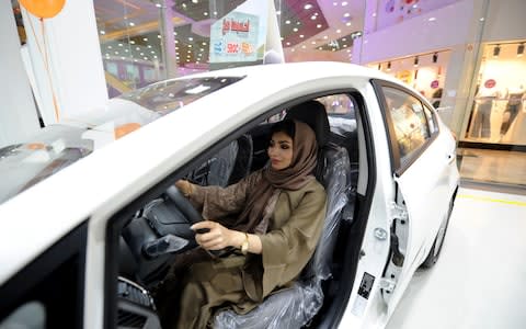 Saudi women tour a car showroom for women on January 11, 2018, in the Saudi Red Sea port city of Jeddah. - Credit: AFP