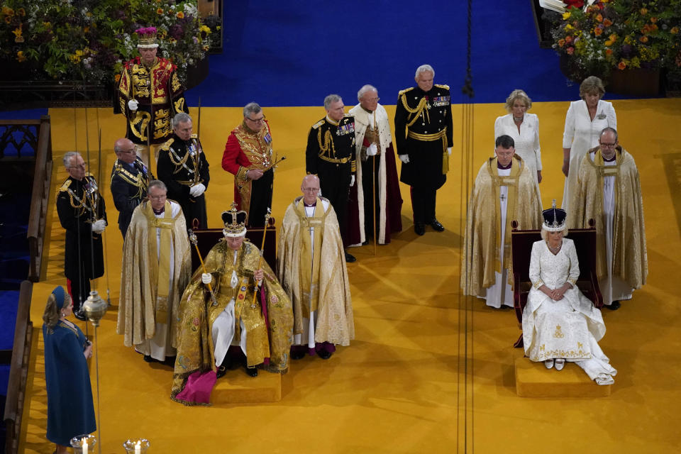 King Charles III wearing the St Edward's Crown and Queen Camilla wearing the Queen Mary's Crown sit during the coronation ceremony at Westminster Abbey, in London, Saturday May 6, 2023. (Andrew Matthews/Pool via AP)