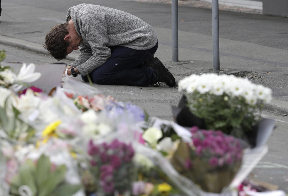 A mourner prays near the Linwood mosque in Christchurch, New Zealand (Picture: AP)