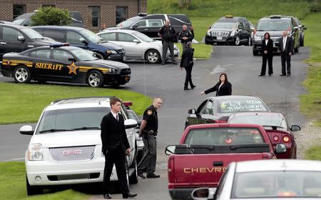 Mourners arrive to attend a funeral for six members of the Rhoden family, who were shot to death in rural Pike County on April 22, at Dry Run Church of Christ in West Portsmouth, Ohio, U.S. May 3, 2016. REUTERS/Kyle Grillot