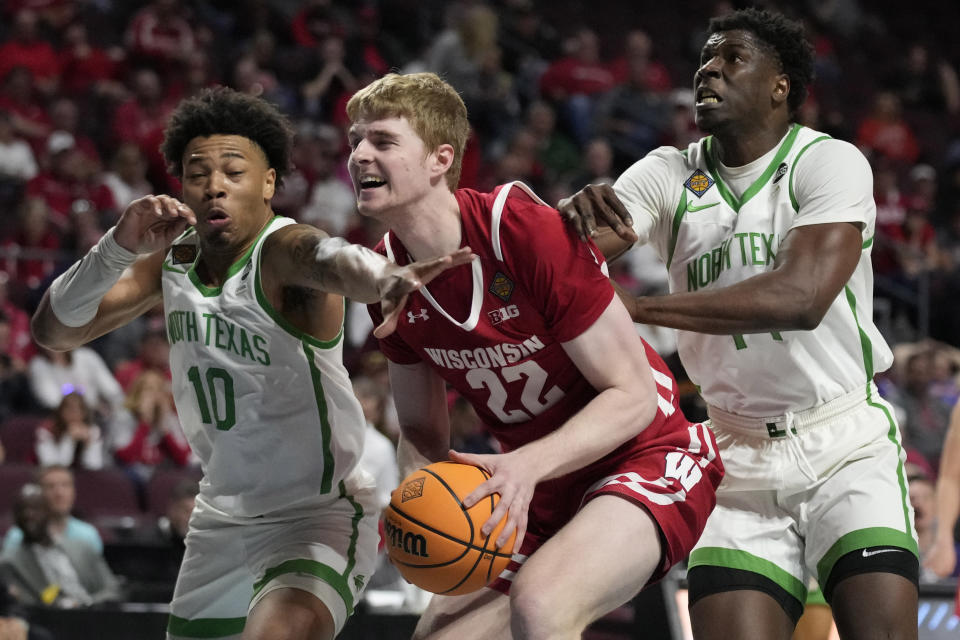 North Texas' Kai Huntsberry (10) and Moulaye Sissoko, right, guard Wisconsin's Steven Crowl (22) during the second half of an NCAA college basketball game in the semifinals of the NIT, Tuesday, March 28, 2023, in Las Vegas. (AP Photo/John Locher)