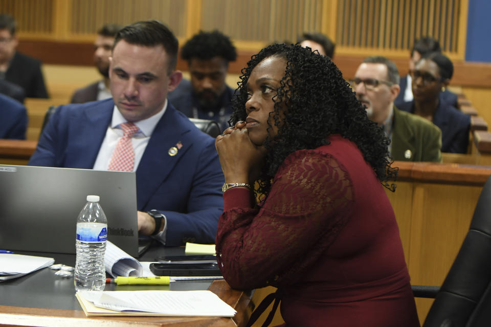 Deputy District Attorney Will Wooten and assistant prosecutor Daysha D. Young listen to the judge during a hearing on charges against former President Donald Trump in the Georgia election interference case on Thursday, March 28, 2024 in Atlanta. Lawyers for Trump argued in a court filing that the charges against him in the Georgia election interference case seek to criminalize political speech and advocacy conduct that is protected by the First Amendment. (Dennis Byron/Hip Hop Enquirer via AP)