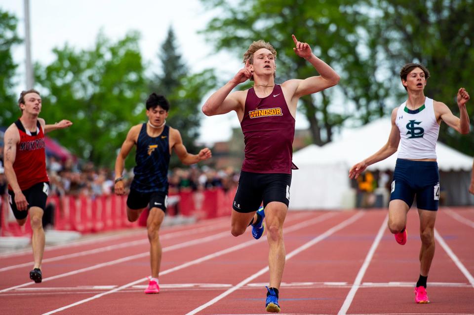 Windsor's Mikey Munn celebrates after crossing the finish line in first place during the Colorado track & field state championships on Saturday, May 17, 2024 at Jeffco Stadium in Lakewood, Colo.
