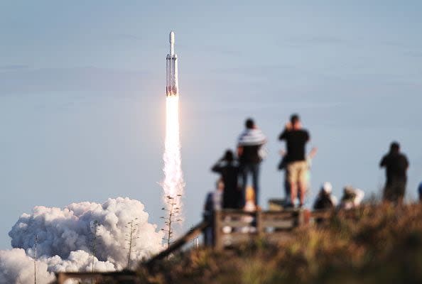 TITUSVILLE, FLORIDA - APRIL 11: People watch as the SpaceX Falcon Heavy rocket lifts off from launch pad 39A at NASA’s Kennedy Space Center on April 11, 2019 in Titusville, Florida. The rocket is carrying a communications satellite built by Lockheed Martin into orbit. (Photo by Joe Raedle/Getty Images)