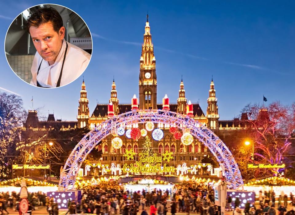 christmas market on rathausplatz in vienna with merry christmas script in german