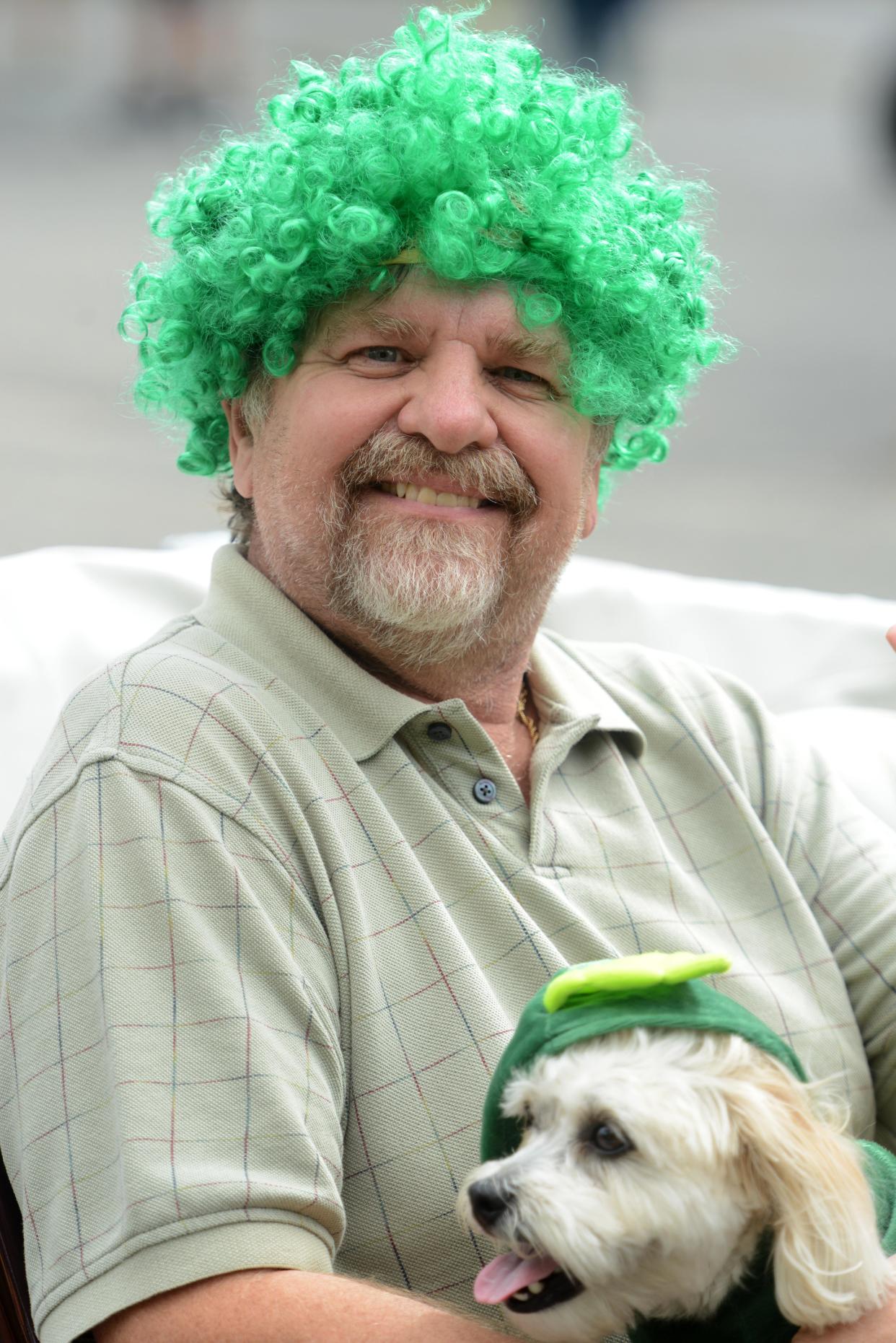 Paul Kula and dog Bailey came dressed to celebrate The Green riding in an antique 1939 Jaguar at the 2021 Cape Cod St. Patrick's Parade. Dressing up seems to be half the fun for spectators at the annual tradition.