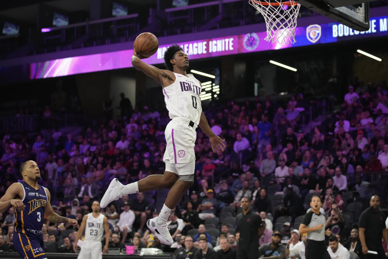 G League Ignite guard Scoot Henderson dunks against Metropolitans 92 during the first half of an exhibition basketball game on Oct. 4, 2022, in Henderson, Nevada. (AP Photo/John Locher, File)