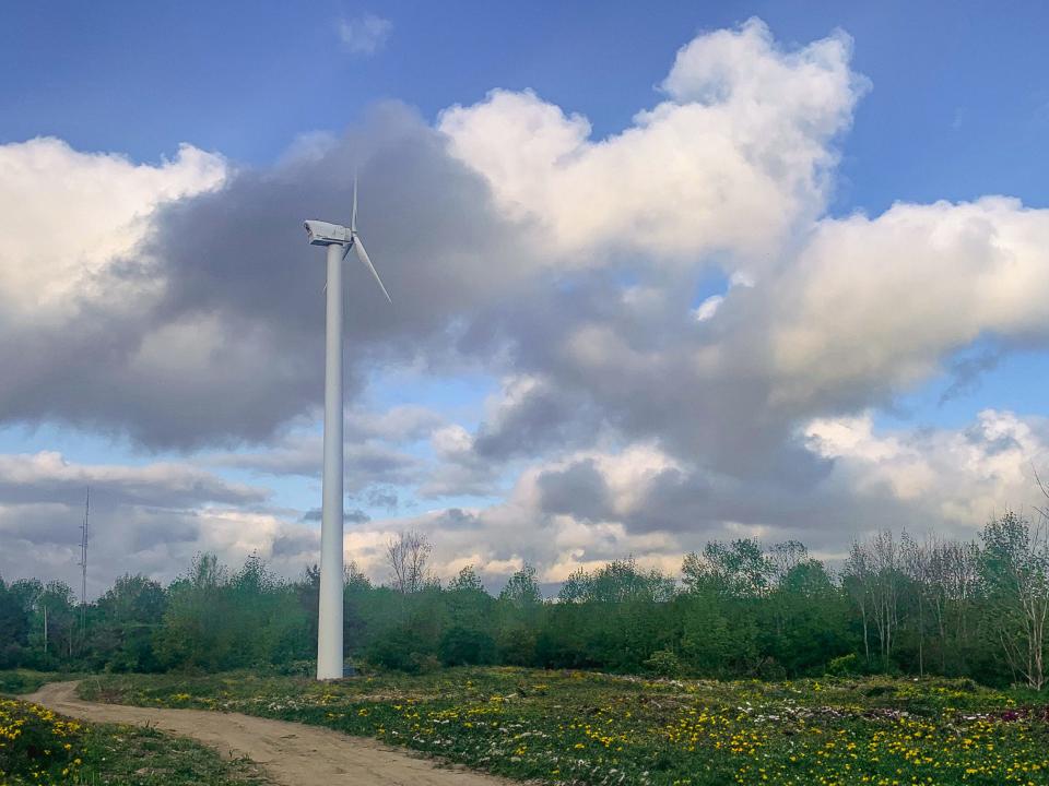 A wind turbine stands over the Alfred State College campus in Allegany County.