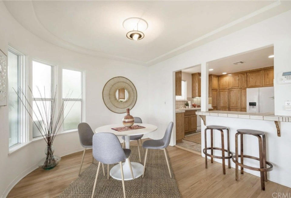 A neutral Scandi style dining area with a small round table