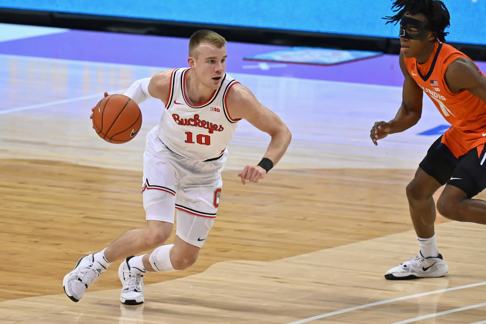 COLUMBUS, OH - MARCH 6:  Justin Ahrens #10 of the Ohio State Buckeyes controls the ball against the Illinois Fighting Illini at Value City Arena on March 6, 2021 in Columbus, Ohio.  (Photo by Jamie Sabau/Getty Images)