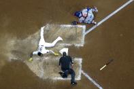 Milwaukee Brewers' Pablo Reyes scores safely past Chicago Cubs catcher Willson Contreras during the eighth inning of a baseball game Saturday, Sept. 18, 2021, in Milwaukee. Reyes scored on a hit by Kolten Wong. (AP Photo/Morry Gash)