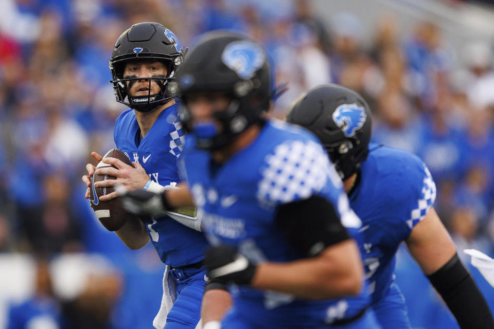 Kentucky quarterback Will Levis (7) looks for an open receiver during the first half of an NCAA college football game against Louisville in Lexington, Ky., Saturday, Nov. 26, 2022. (AP Photo/Michael Clubb)