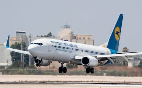 A Boeing 737-3E7 from Ukraine International Airlines lands in 2017 - Credit: Jack Guez/AFP