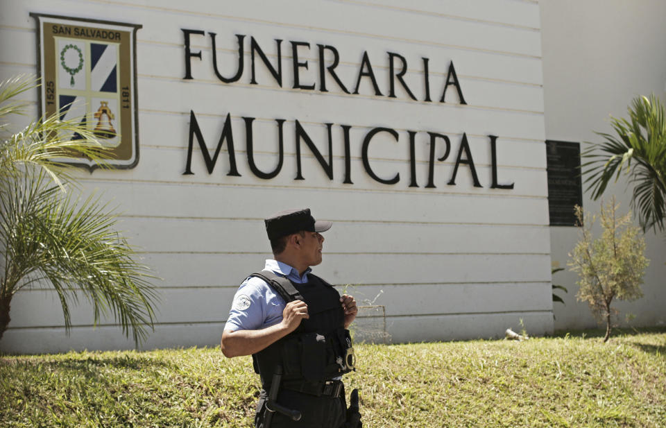 A municipal police officer stands outside the Municipal Funeral Home at La Bermeja Cemetery, where the bodies of Óscar Alberto Martínez Ramírez, 25, and his daughter Valeria, 23 months, arrived in San Salvador, El Salvador, Sunday, June 30, 2019. Martínez and his daughter were swept away by the border river between Matamoros, Mexico, and Brownsville, Texas, on Sunday, June 23, and their bodies were found the next morning. The wife and mother, Tania Vanessa Ávalos, survived. (AP Photo/Salvador Melendez)