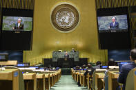 In this UN Photo, Volkan Bozkir, President of the 75th session of the United Nations General Assembly, is shown on video monitors as he makes closing remarks, Tuesday, Sept. 29, 2020, at U.N. headquarters. (Loey Felipe/UN Photo via AP)