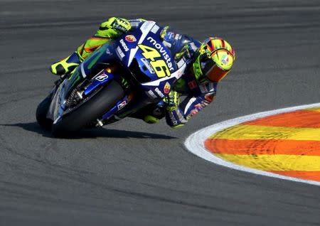 FILE PHOTO: Yamaha MotoGP rider Valentino Rossi of Italy takes a curve during the Valencia Motorcycle Grand Prix at the Ricardo Tormo racetrack in Cheste, near Valencia, November 8, 2015. REUTERS/Heino Kalis