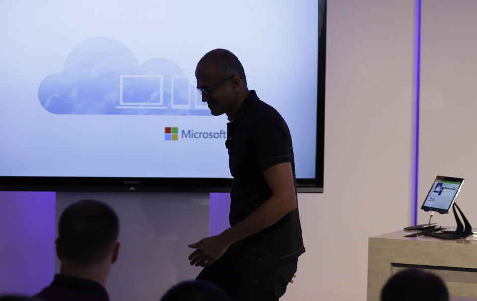 Microsoft CEO Satya Nadella exits the stage after speaking at a press briefing on the intersection of cloud and mobile computing Thursday, March 27, 2014, in San Francisco. Microsoft unveiled Office for the iPad, a software suite that includes programs such as Word, Excel and PowerPoint, and works on rival Apple Inc.'s hugely popular tablet computer. (AP Photo/Eric Risberg)