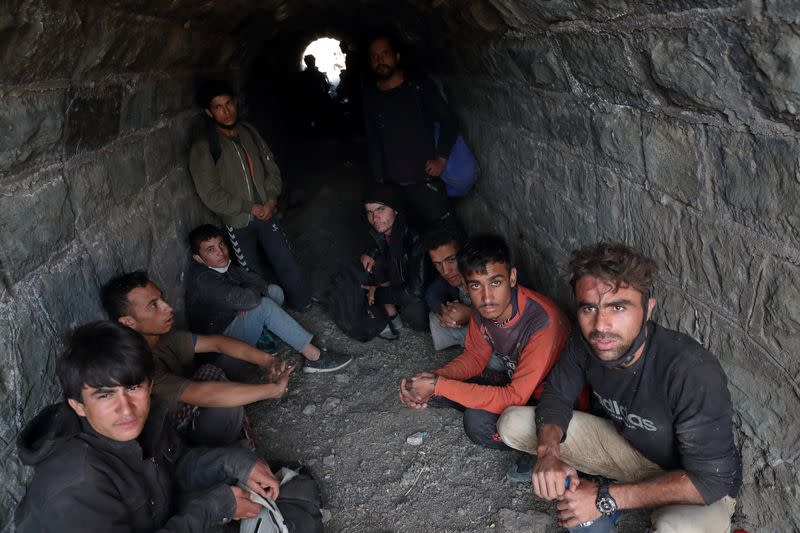 Migrants from Afghanistan hide from security forces after crossing illegally into Turkey from Iran, near Tatvan