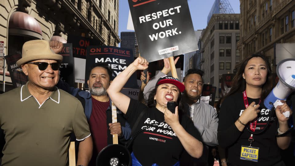 A group marches in support of hotel workers near San Francisco's Union Square on September 2. - Benjamin Fanjoy/AP