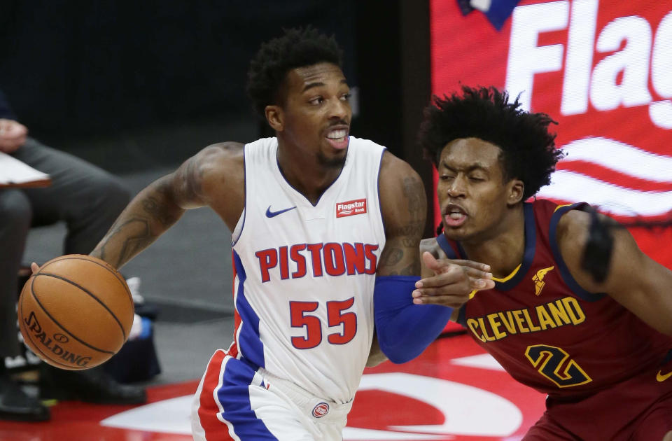 Detroit Pistons guard Delon Wright, left, drives to the basket against Cleveland Cavaliers guard Collin Sexton, right, during the first half of an NBA basketball game Saturday, Dec. 26, 2020, in Detroit. (AP Photo/Duane Burleson)