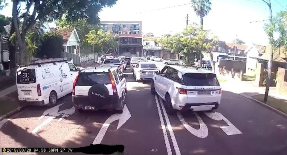 The driver attempts to push in after overtaking on double lines. Source: Ray Hadley Morning Show