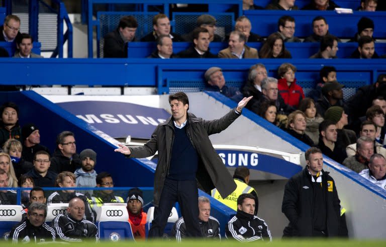 Swansea City's Danish manager Michael Laudrup gestures during the League Cup semi-final at Chelsea on January 9, 2013. Swansea won the first-leg match 2-0. But Laudrup refused to accept his side were favourites to go through and play either fourth-tier Bradford or Premier League rivals Aston Villa