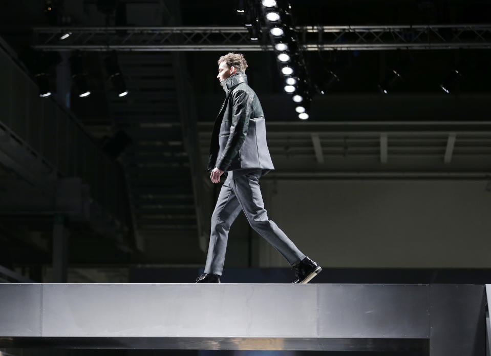 A model wears a creation for Fendi men's Fall-Winter 2013-14 collection, part of the Milan Fashion Week, unveiled in Milan, Italy, Monday, Jan. 14, 2013. (AP Photo/Antonio Calanni)