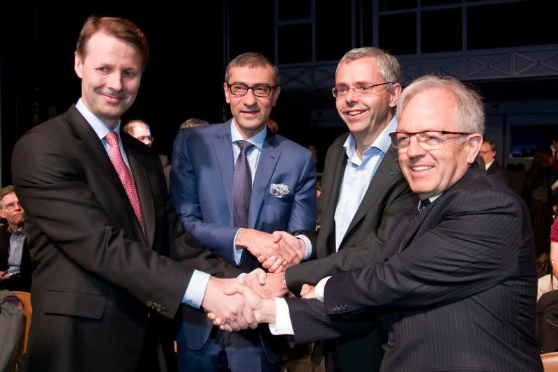 FILE PHOTO: Nokia's chairman Risto Siilasmaa, Nokia's President and Chief Executive Rajeev Suri, Telecom equipment maker Alcatel-Lucent's Chief Executive Officer Michel Combes and Alcatel-Lucent's chairman of the supervisory board Philippe Camus pose in Pa