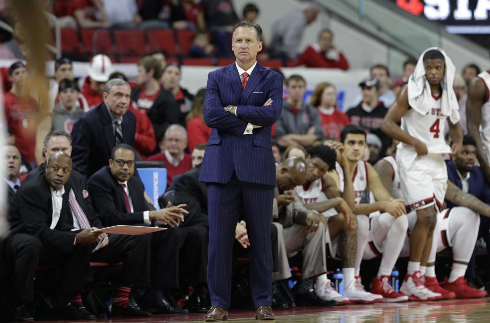 In this Wednesday, Feb. 15, 2017, photo, North Carolina State head coach Mark Gottfried watches during the second half of an NCAA college basketball game against North Carolina in Raleigh, N.C. North Carolina State says Gottfried won't return for a seventh season but will coach the remainder of this season. (AP Photo/Gerry Broome)