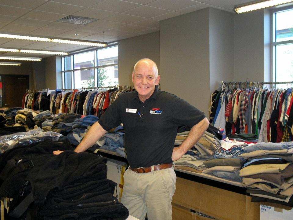 Dan Straughan, executive director of the Homeless Alliance, stands in the free clothing room for at-risk and homeless veterans at the Homeless Alliance WestTown Resource Center in Oklahoma City.