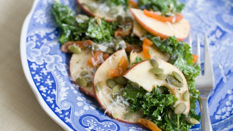 This March 10, 2014, photo shows kale salad with apples, apricots and manchego cheese in Concord, N.H.