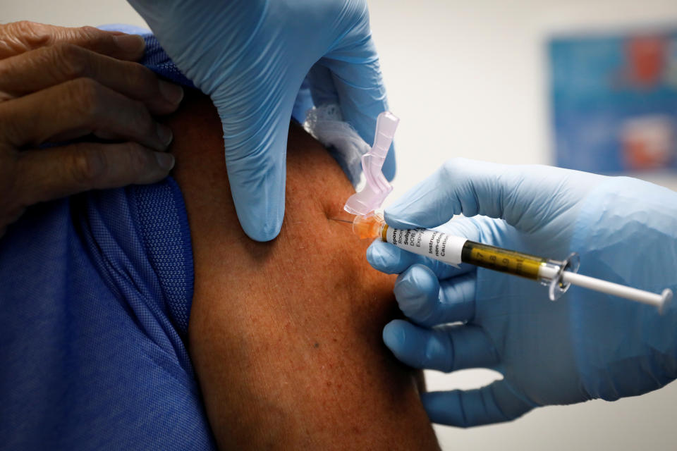 A volunteer is injected with a vaccine as he participates in a coronavirus disease (COVID-19) vaccination study at the Research Centers of America, in Hollywood, Florida, U.S., September 24, 2020. REUTERS/Marco Bello