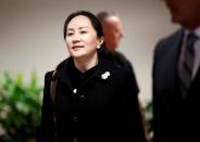 Huawei Chief Financial Officer Meng Wanzhou leaves B.C. Supreme Court for a lunch break during the first day of her extradition hearing in Vancouver