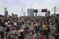 Thousands of people take part in a demonstration in Rotterdam, Netherlands, Wednesday, June 3, 2020, to protest against the recent killing of George Floyd, police violence and institutionalized racism. Floyd, a black man, died in police custody in Minneapolis, U.S.A., after being restrained by police officers on May 25, 2020. (AP Photo/Peter Dejong)