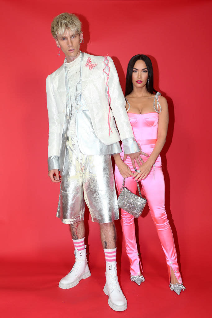 Machine Gun Kelly and Megan Fox posing on the iHeart Radio carpet