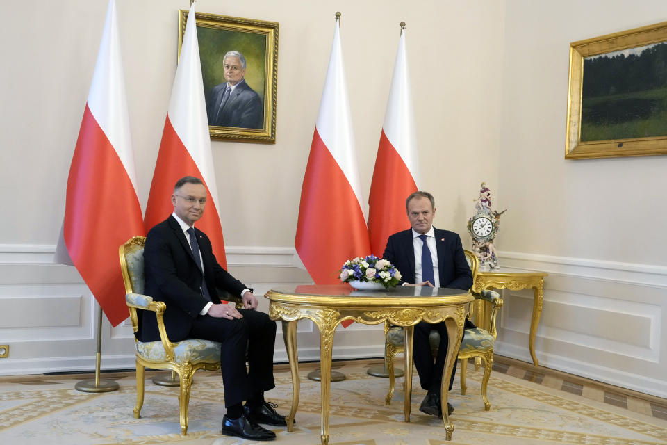 Poland's President Andrzej Duda, left, who is allied with the right-wing opposition, sits with new pro-European Union Prime Minister Donald Tusk during talks on Poland's security and continuing support for neighbouring Ukraine, at the Presidential Palace in Warsaw, Poland, Monday Jan. 15, 2024. Tusk is to travel to Kyiv in the coming days at the invitation of Ukraine President Volodymyr Zelenskyy. (AP Photo/Czarek Sokolowski)