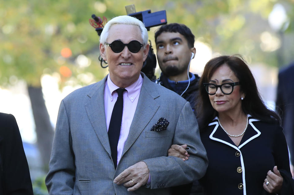 Roger Stone, with his wife, Nydia Stone, right, arrive at the federal court in Washington, Tuesday, Nov. 5, 2019. Stone, a longtime Republican provocateur and former confidant of President Donald Trump, goes on trial over charges related to his alleged efforts to exploit the Russian-hacked Hillary Clinton emails for political gain. (AP Photo/Manuel Balce Ceneta)