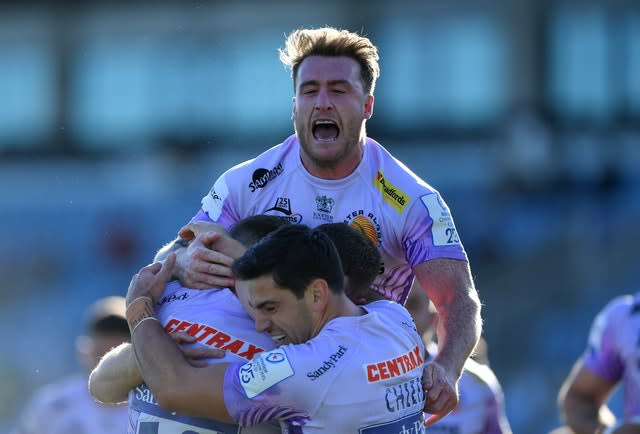 Exeter celebrate their fourth try against Toulouse