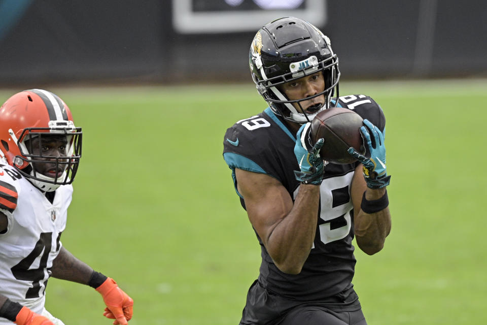 Jacksonville Jaguars wide receiver Collin Johnson (19) makes a reception in front of Cleveland Browns safety Karl Joseph during the first half of an NFL football game, Sunday, Nov. 29, 2020, in Jacksonville, Fla. (AP Photo/Phelan M. Ebenhack)